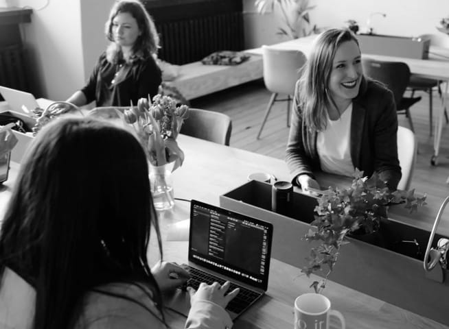 smiling workers in a meeting